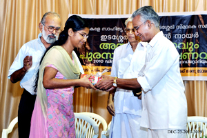 Nijila receiving the gift from Prof. K.P. Shankaran