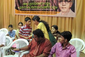 Ebin presenting bouquet to Sharmila