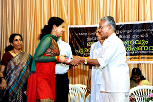 Jayapriya receiving the gift from Prof. K.P. Shankaran