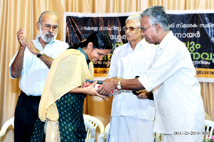 Sharmila receiving the gift from Prof. K.P. Shankaran