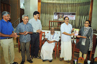 Dr.P.V. Krishbnan Nair releasing the book Edasseriyude Kathakal. Receiving the book is Shahina E.K.