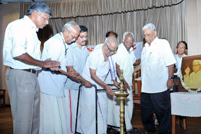 Mahakavi Akkitham lighting the lamp to inaugurate the function.