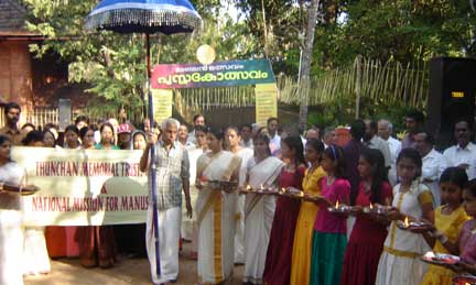 Procession with the ceremonial umbrella, thalam and traditional lamp at the inaugural function.